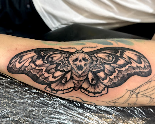 Explore men's neck tattoo ideas, creative tattoo ideas in Charlotte, available at Olive Branch Tattoo Studio