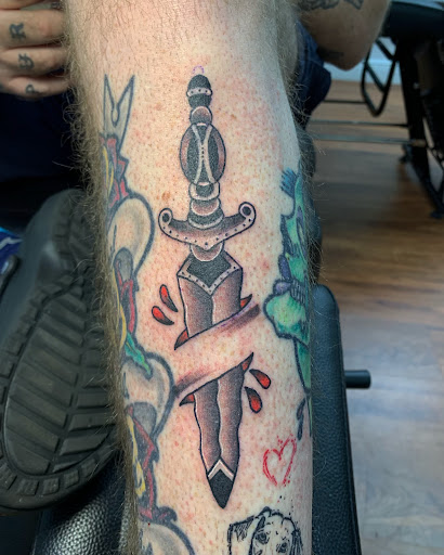 Explore tattoo ideas for men leg, creative tattoo ideas in Cocoa, available at Rorschach Tattoo Shop and Piercing Studio