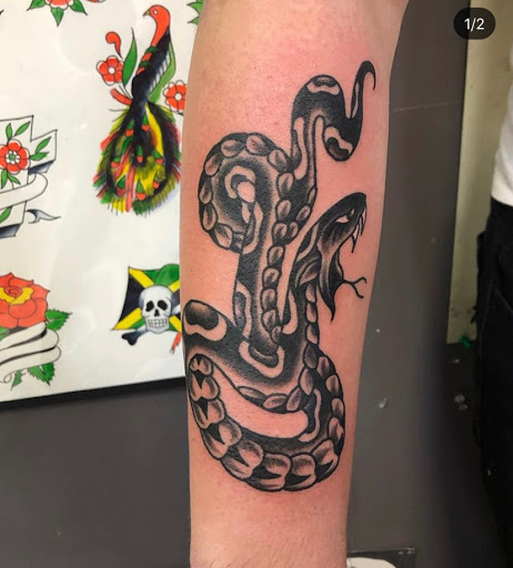 Explore husband's name tattoo ideas, creative tattoo ideas in Kansas City, available at Grimm Tattoo and Bert Grimm Museum