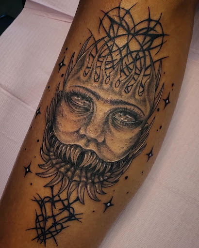 Find middle boob tattoo ideas for your next unique tattoo in Palm Harbor at Angry Owl Tattoo and Piercing