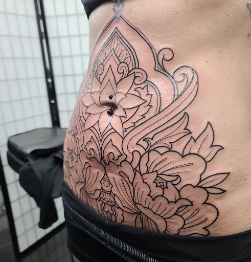 Explore nike tattoo ideas, creative tattoo ideas in Addison, available at Cat Tattoo