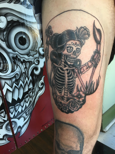 Explore cute woman tattoo ideas, creative tattoo ideas in Wilmington, available at Trademark Tattoo