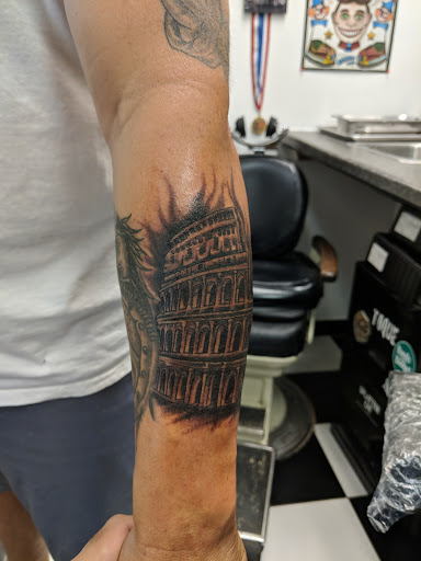 Explore mens infinity tattoo ideas, creative tattoo ideas in Brick, available at Black Panther Tattoo