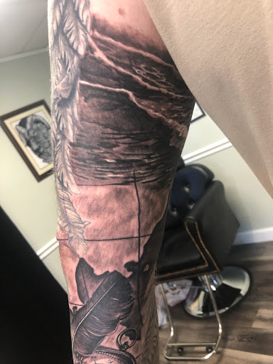 Explore memorial cross tattoo ideas, creative tattoo ideas in Englewood, available at Point of Entry Tattoo