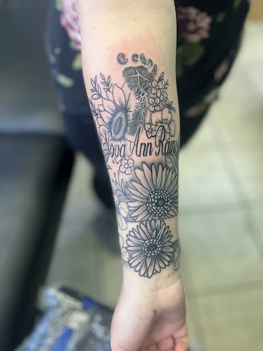 Explore ideas for roman numeral tattoos, creative tattoo ideas in Osage Beach, available at Lake Ozark Tattoo and Hair Studio