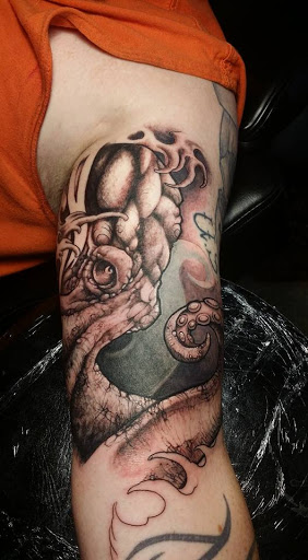 Explore turtle tattoo ideas for guys, creative tattoo ideas in Fuquay Varina, available at 401 Tattoo and Antiquities
