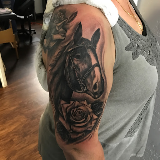 Explore wolf tattoo ideas for men, creative tattoo ideas in Lawton, available at Avenue Tattoo Studio