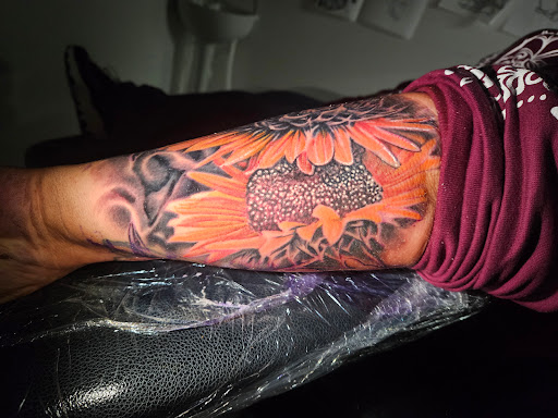 Explore emerald tattoo ideas, creative tattoo ideas in Angola, available at Hoodlum Ink