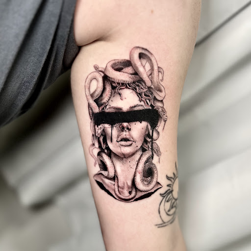 Explore small cardinal tattoo ideas, creative tattoo ideas in Wilmington, available at Rogue Tattoo Studio