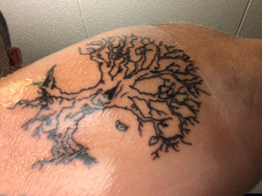 Explore fine line spine tattoo ideas, creative tattoo ideas in Buffalo, available at East Coast Ink