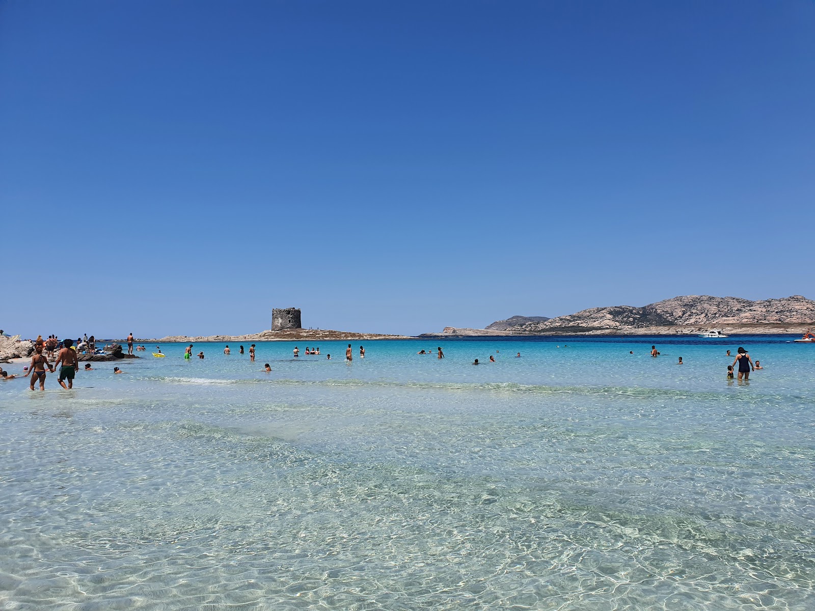 Photo of La Pelosa Beach with turquoise pure water surface