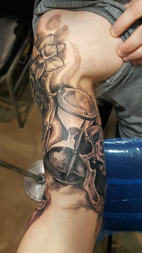 Explore guns and roses tattoo ideas, creative tattoo ideas in Spencer, available at Ink Envy Tattoo And Body Piercing