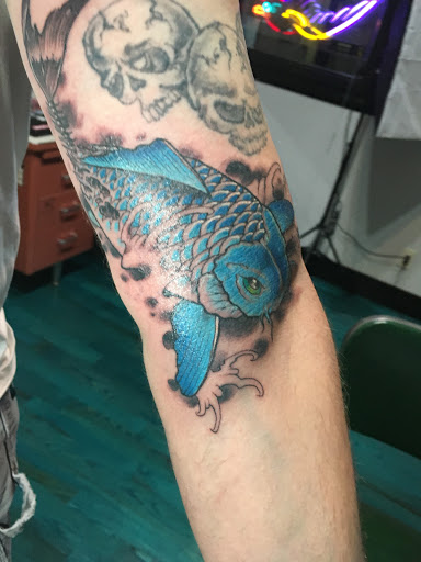 Explore front neck tattoo ideas, creative tattoo ideas in Reno, available at Aces Tattoo