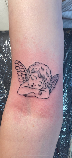 Explore mens inner bicep tattoo ideas, creative tattoo ideas in Clintonville, available at Honey Heart Tattoo