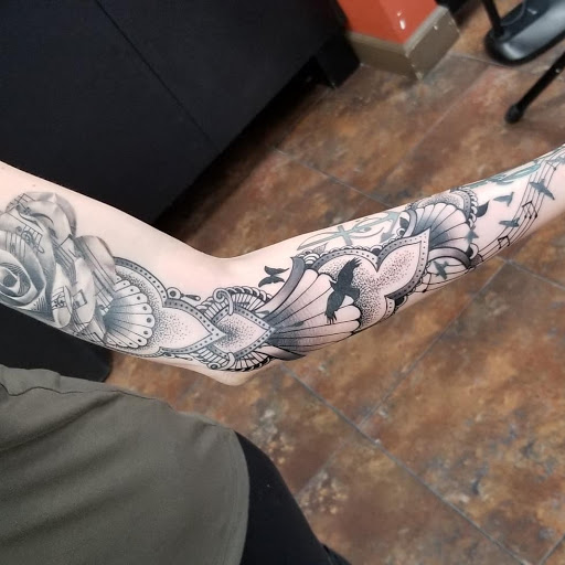 Explore leg tattoo idea for men, creative tattoo ideas in Maryland Heights, available at Thirteen Roses Tattoo & Aesthetics