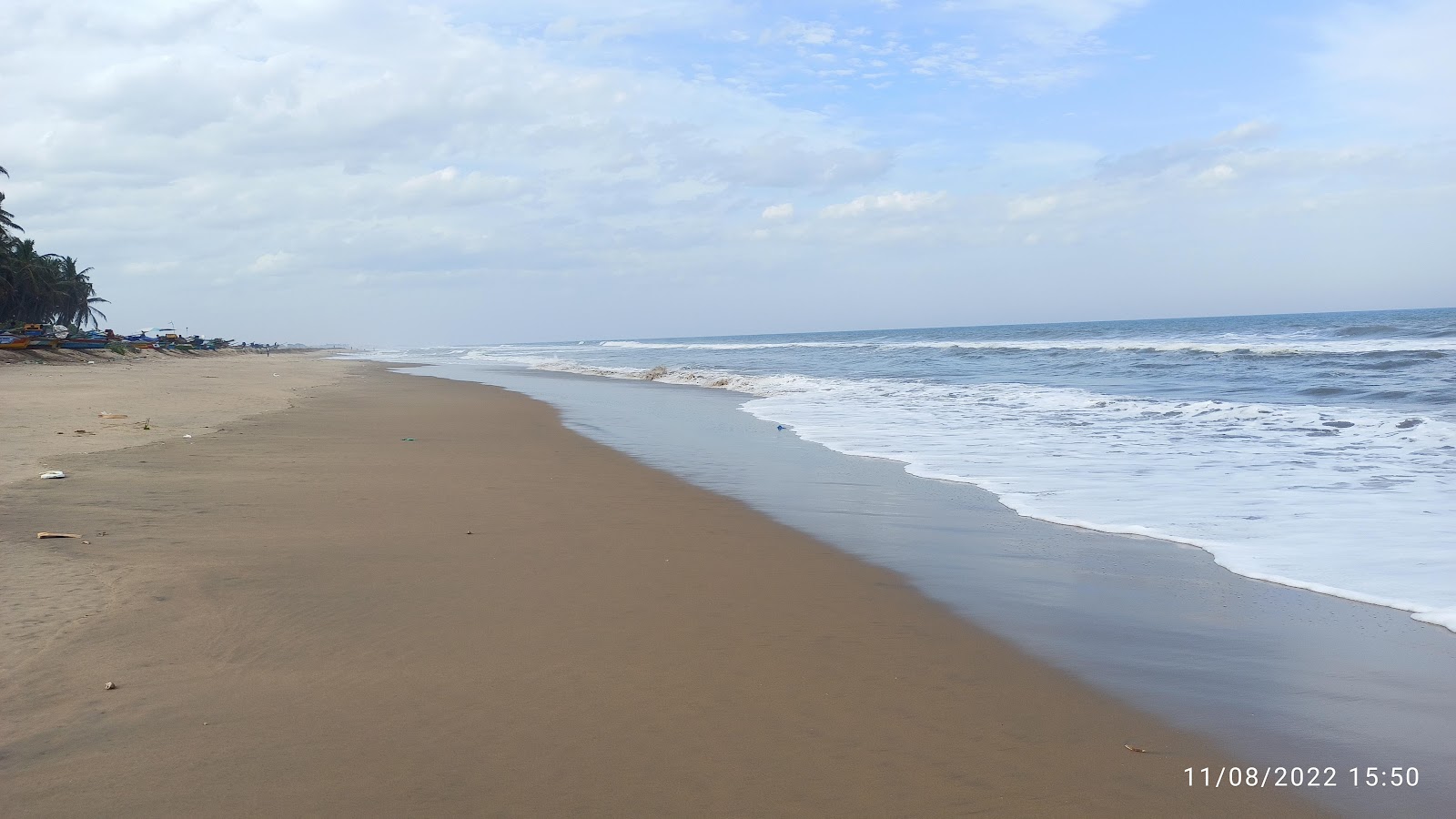 Fotografija PCKM Beach z svetel pesek površino