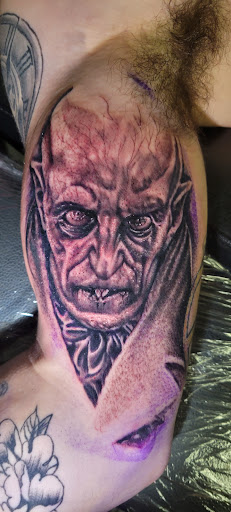 Explore guns n roses tattoo ideas, creative tattoo ideas in Angola, available at Hoodlum Ink