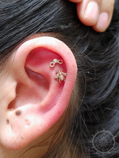 Explore hood tattoo ideas, creative tattoo ideas in Eau Claire, available at Steel N Ink Body Piercing