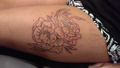 Find christmas tattoo ideas for your next unique tattoo in Bridgeport at Pike Street Studios Tattoo and Body Piercing