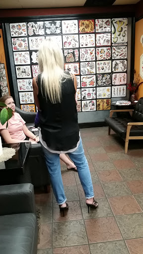 Explore cover up tattoo ideas for upper arm, creative tattoo ideas in Saint Louis, available at All Star Tattoo