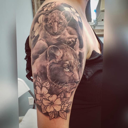 Find tropical flower tattoo ideas for your next unique tattoo in Charles Town at Blue Heron Tattoo