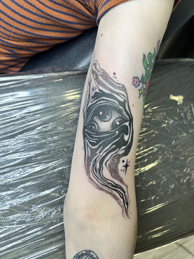 Explore rock tattoo ideas, creative tattoo ideas in Milwaukee, available at Beauty is Pain Tattoo and Body Piercings