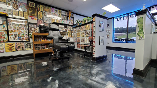 Explore tribal dragon tattoo ideas, creative tattoo ideas in Stockbridge, available at Black Rose Tattoo Collective