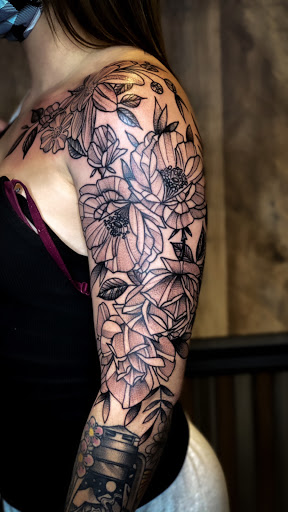 Explore arm tattoos for women ideas, creative tattoo ideas in Elkview, available at Andy Electric Tattoos