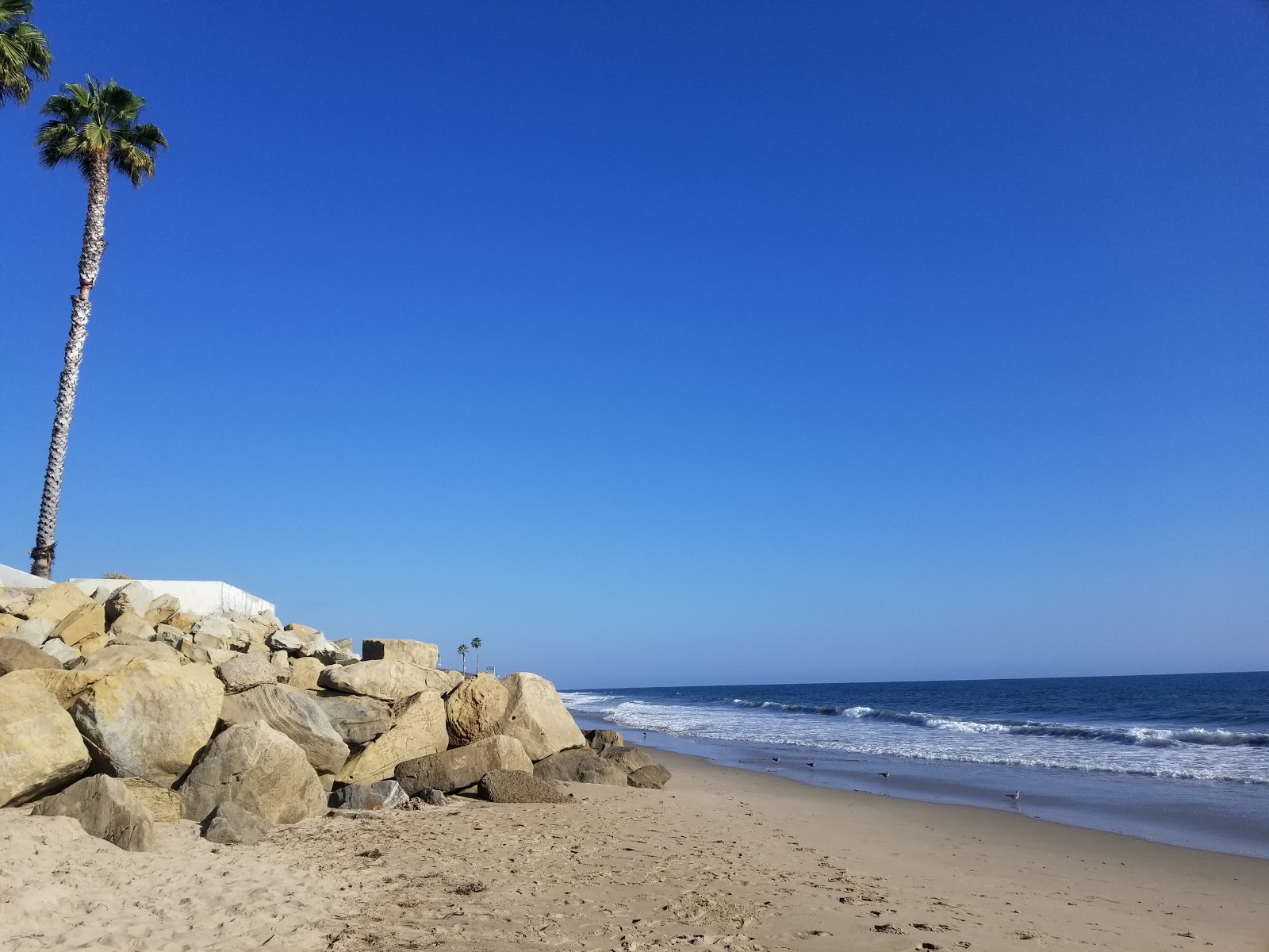 Fotografija Pier Shoals Beach z svetel pesek površino