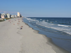 Garden City Pier beach'in fotoğrafı düz ve uzun ile birlikte