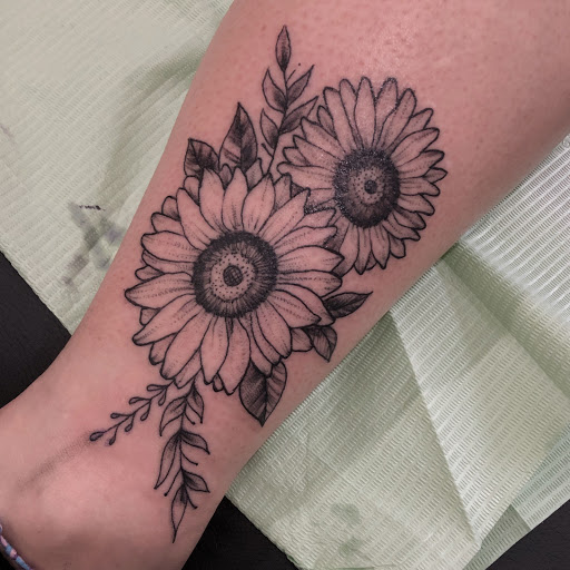 Find christmas tattoo ideas for your next unique tattoo in Duluth at Gitchee Gumee Tattoo