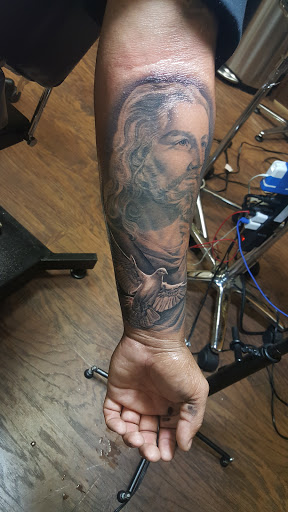 Explore squid tattoo ideas, creative tattoo ideas in Denton, available at Dark Age Tattoo Studio