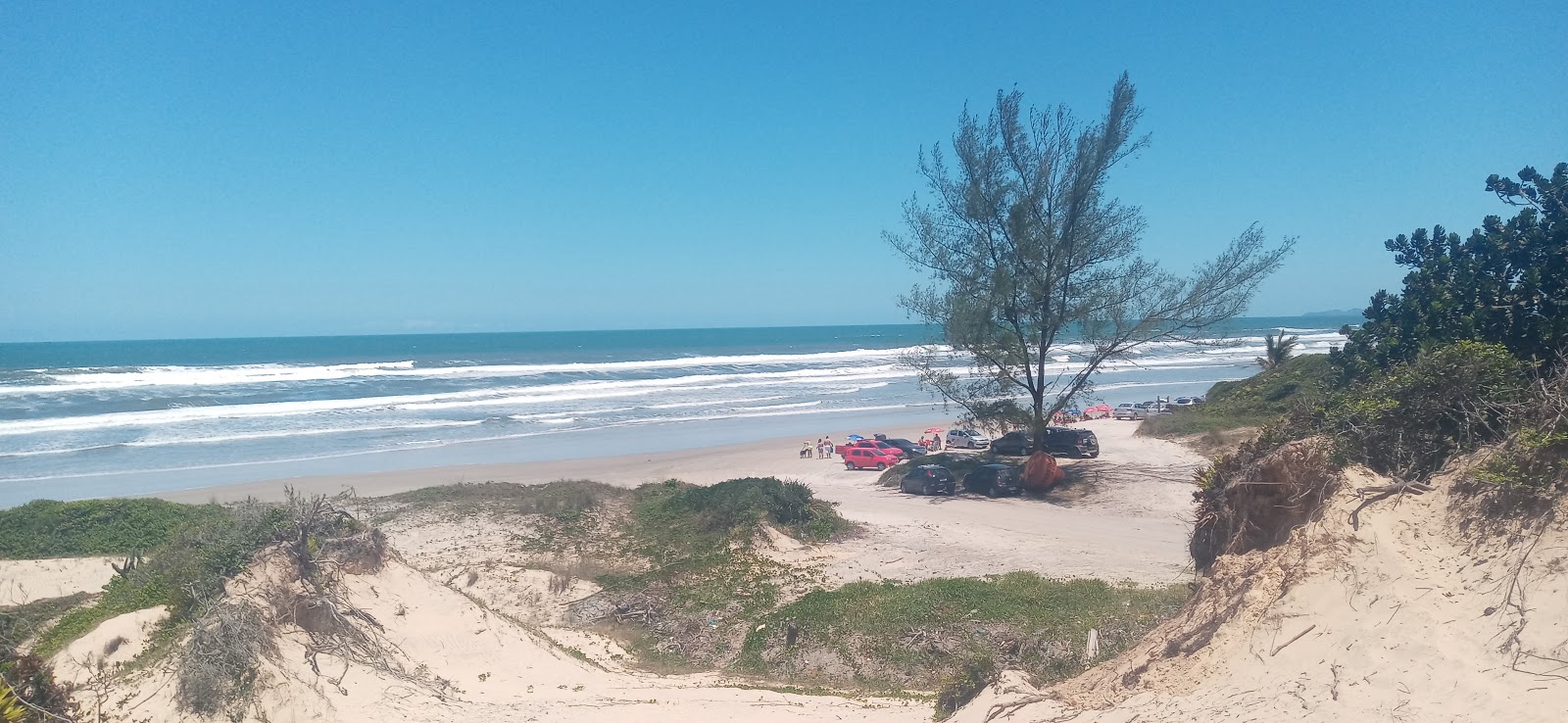 Fotografie cu Pedrinhas Beach cu o suprafață de nisip beige