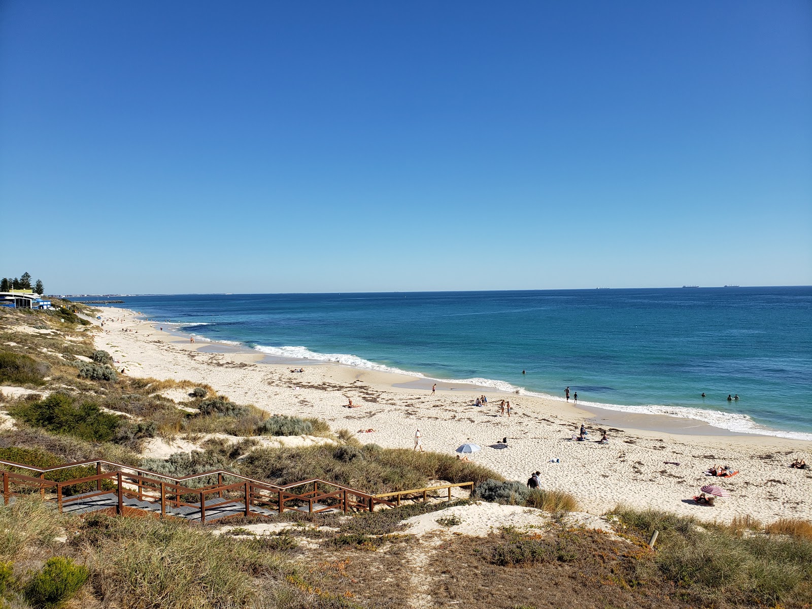 Foto van Grand Street Beach met helder zand oppervlakte