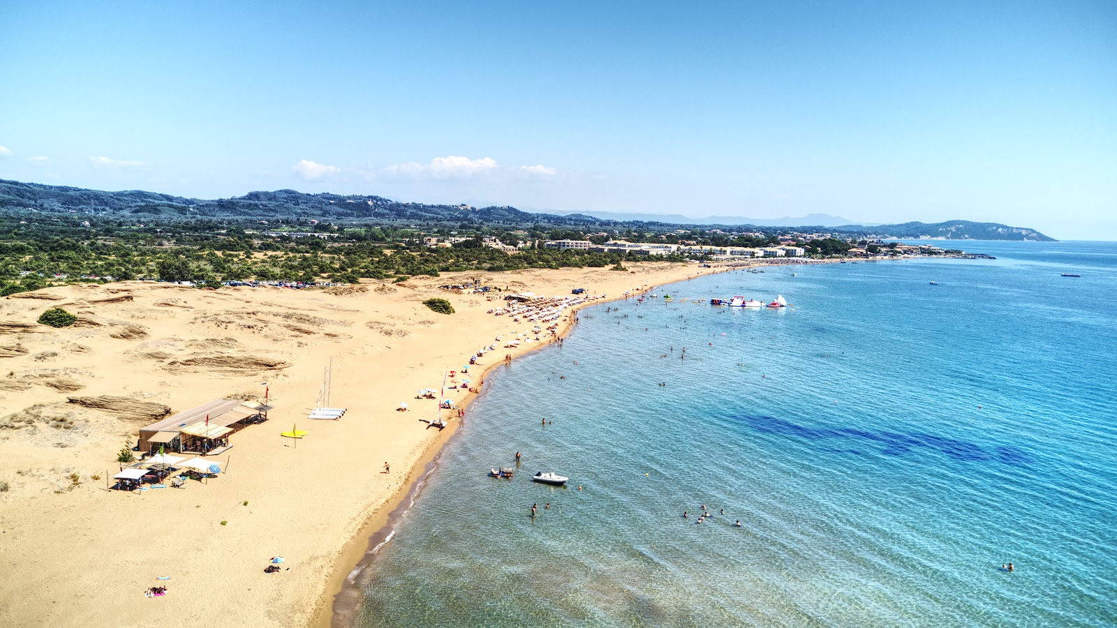 Photo of Issos beach with bright fine sand surface