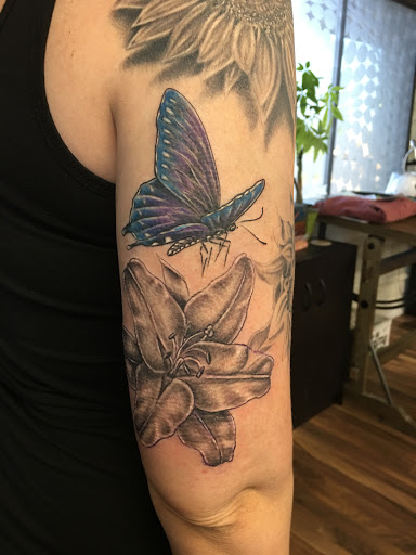 Explore mountain bike tattoo ideas, creative tattoo ideas in Peoria, available at Iron Key Tattoo Studio Inc.