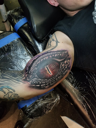 Explore kaws tattoo ideas, creative tattoo ideas in Fulton, available at The Kings Head Tattoo Company