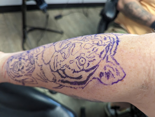 Explore outside forearm tattoo ideas, creative tattoo ideas in Greenwood, available at Outlaw Tattoo Co