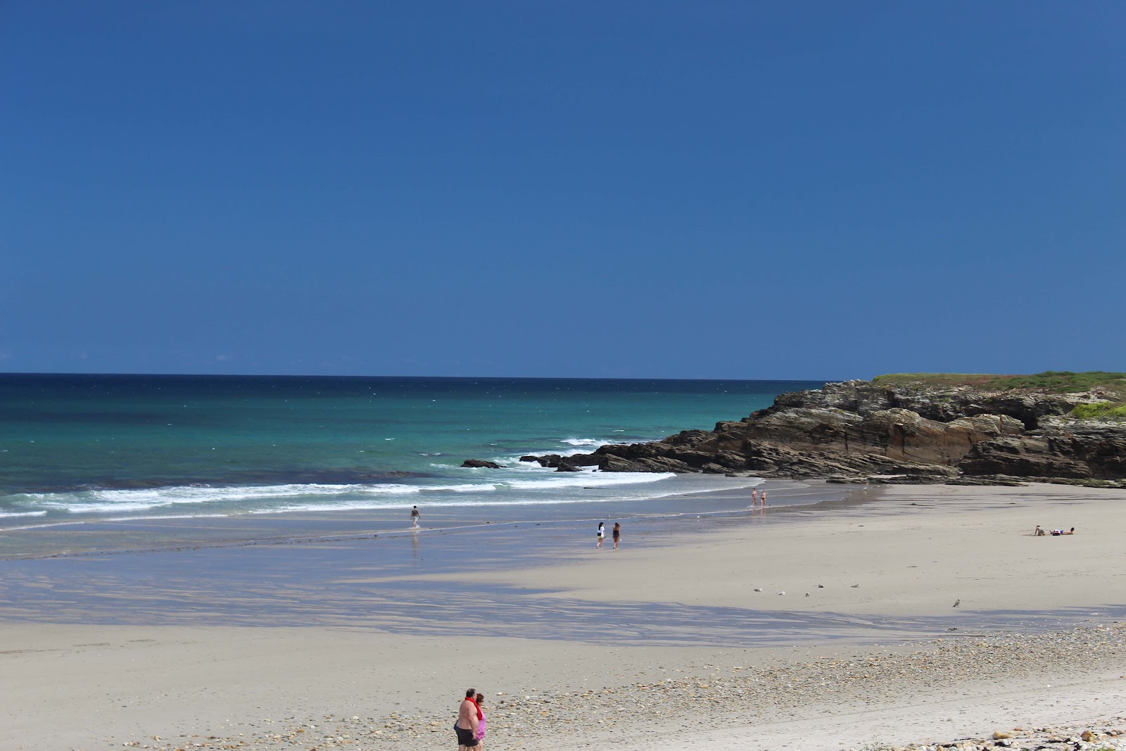 Foto di Praia Area Longa con una superficie del ciottoli beige