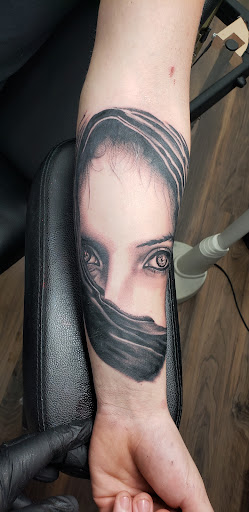 Explore women's hand tattoo ideas, creative tattoo ideas in Ocala, available at Black Lotus Tattoo & Art Gallery Inc