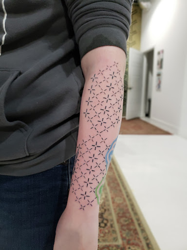 Explore rock tattoo ideas, creative tattoo ideas in Lufkin, available at Black Spot Tattoo Company