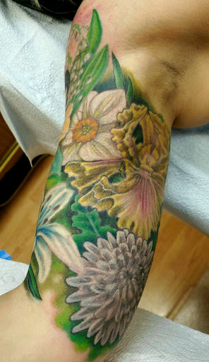 Explore tiger lily tattoo ideas, creative tattoo ideas in Hammonton, available at Exotic Body Works