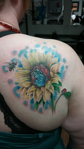 Explore cute flower tattoo ideas, creative tattoo ideas in Rock Island, available at OTool Design Custom Tattoo