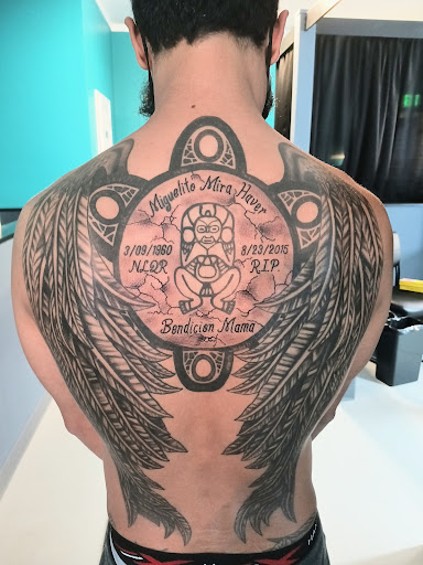 Find wristband tattoo ideas for your next unique tattoo in Spencer at Inkorporated Body Art