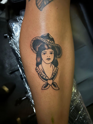 Explore ripped skin tattoo ideas, creative tattoo ideas in Spring, available at Art Immortal Woodlands Tattoo and Piercing