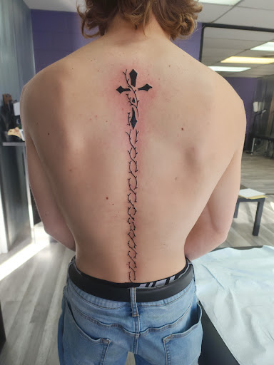 Explore cool cross tattoo ideas, creative tattoo ideas in Dickinson, available at Creative InSight Tattoo