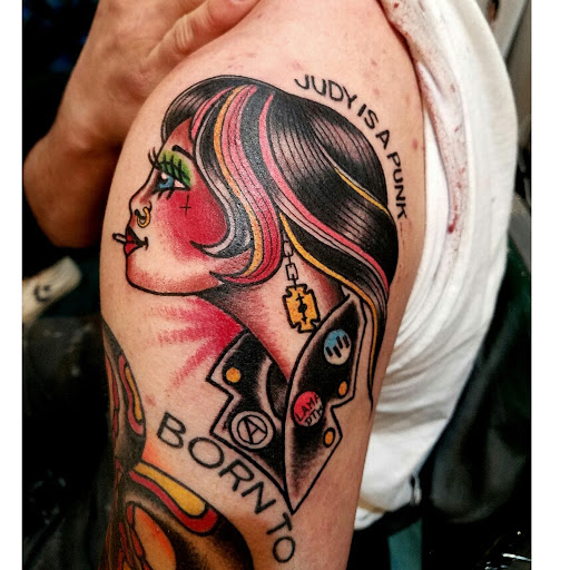 Explore women's lower back tattoo ideas, creative tattoo ideas in Reno, available at Aces Tattoo