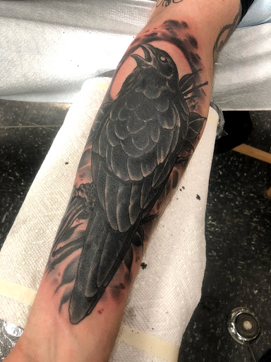 Find face tattoo idea for your next unique tattoo in Lincoln at Iron Brush Tattoo