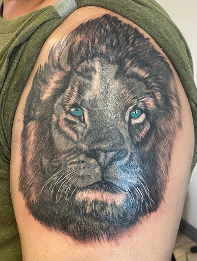 Explore shoulder tattoo ideas for men, creative tattoo ideas in Davenport, available at Fine Ink Studios Tattoos