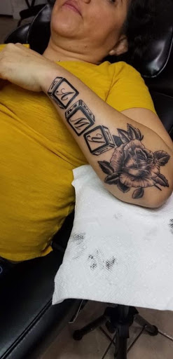 Explore neck word tattoo ideas, creative tattoo ideas in Houston, available at MS Studios Houstons Ink Therapy